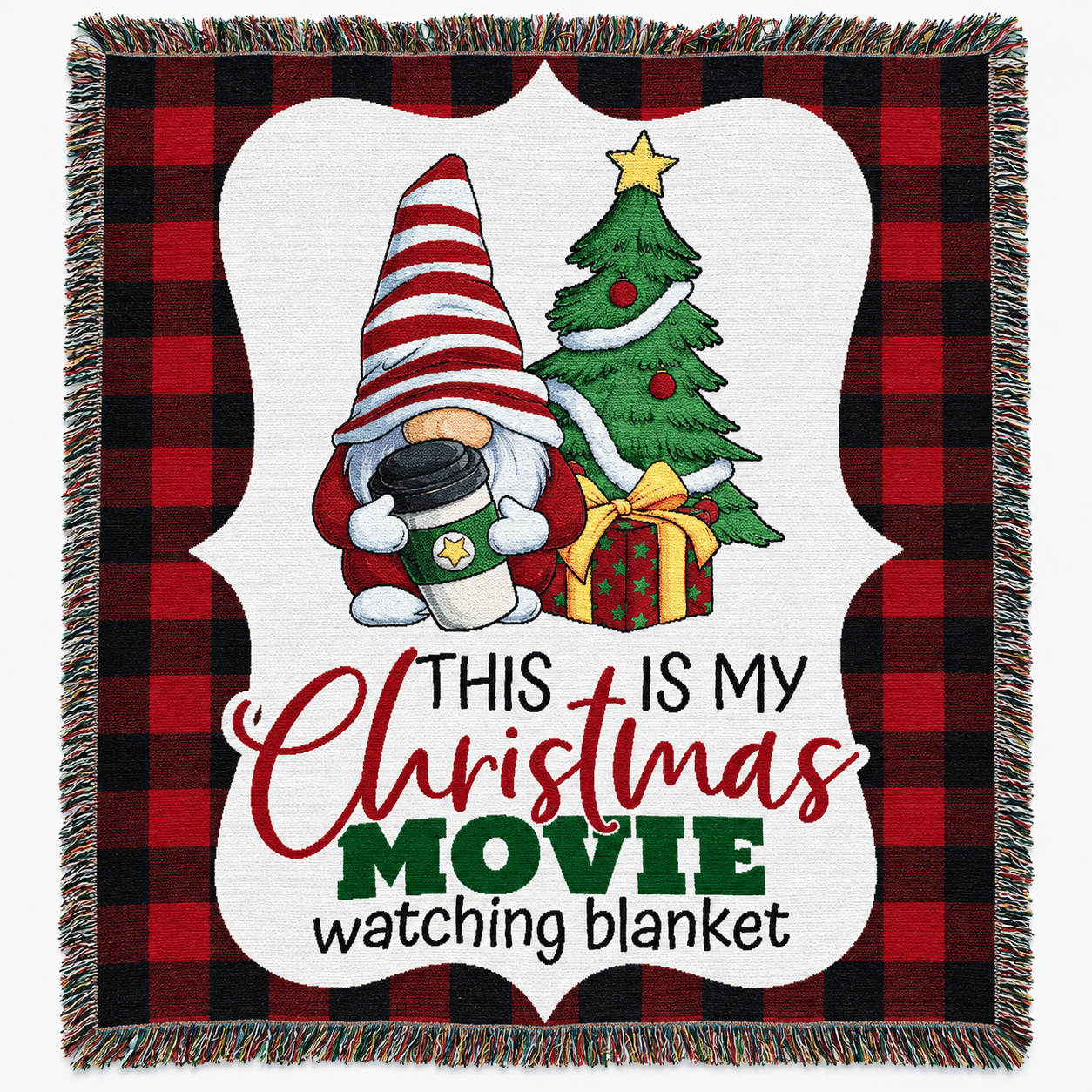 A blanket with a gnome holding cocoa, a Christmas tree, and gifts. Text reads: This is my Christmas movie watching blanket on a red and black plaid background.
