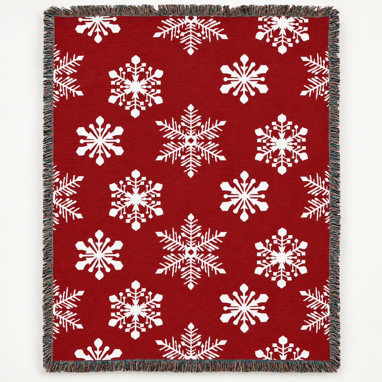 The USA Made 100% Cotton Woven Throw Blanket - Snowflakes Red features a red background, white snowflake pattern, and a fringe border.