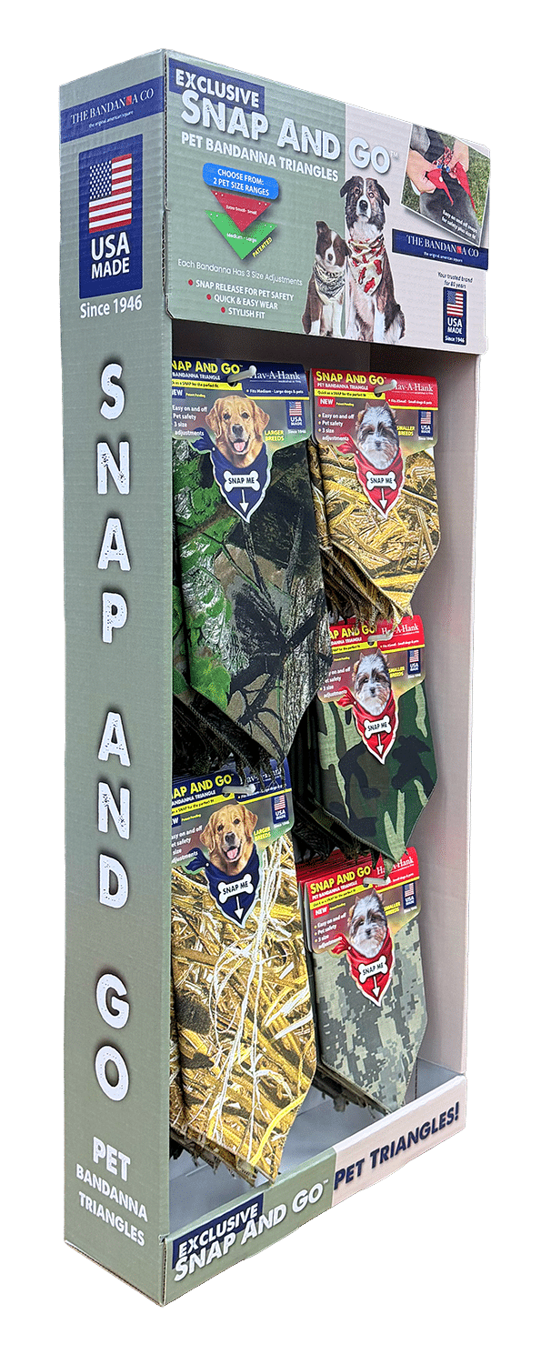 Display box of Snap and Go pet bandanna triangles in camouflage and hunting patterns, with images of dogs wearing them. The packaging highlights USA Made and product features.