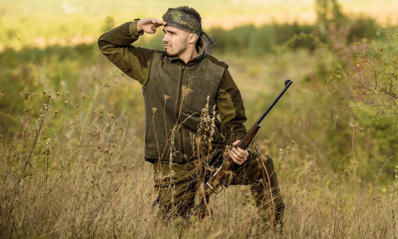 Hunter wearing camouflage buck country bandanna